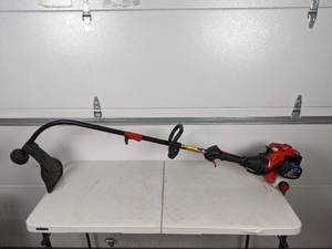 lot 65 image: Troy-Bilt 2 Cycle Gas String Timmer