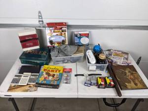 lot 128 image: An Assortment of Unique Items- Games, Magazines, Calculators, Padlocks, and