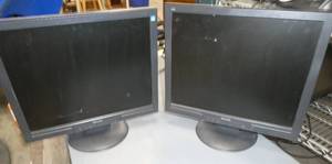 Two Phillips 17 inch across monitors