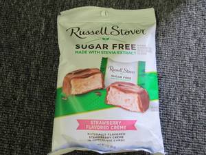 lot 129 image: 93oz bags of rusell stover sugar f...