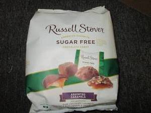 lot 134 image: 31lb 1.6 oz bags of russell stover...