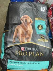 lot 330 image: 34lbs of purina pro plan puppy food...