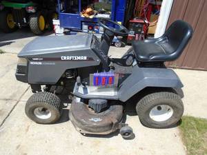 lot 100 image: Craftsman riding lawn mower. 42 cut. 14 hp Kohler command motor. Used condition. Tested & runs. As shown.