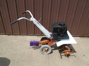 lot 103 image: Vintage front tine sears garden tiller. Used condition. Tested & runs. As shown.
