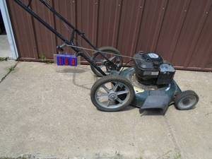 lot 104 image: Craftsman big wheeled push lawn mower. Used condition. Tested & works. As shown.