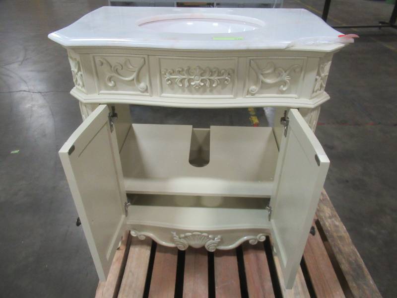 lot 40 image: Winslow 33 in. W x 22 in. D Bath Vanity in Antique White with Vanity Top in White Marble with White Basin - RH Door Needs adjustment, Cracked Top.