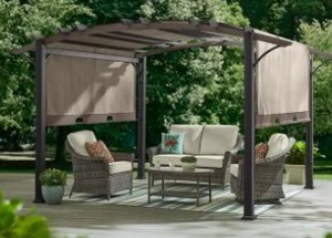 lot 50 image: Hampton Bay Orchard Park 10.6 ft. x 13.3 ft. Brown Steel Arched Beam Pergola with Sling Canopy, A106009001. - Unclaimed Freight.