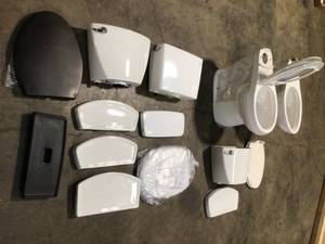 Lot of 2 Toilets and toilet parts Customer Returns See Pictures