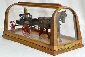 lot 77 image: Vintage Hand-Crafted Scale Model of Horse-Drawn Spindle Seat Buggy in Custom Case By Harry Bystrom