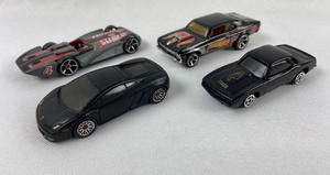 lot 134 image: Lot of four toy cars- 1 164 Hot Wheels & 3 Black Cars