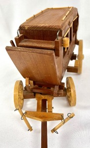 lot 84 image: Hand Crafted Wooden Folkart Stagecoach Model By Harry Bystrom