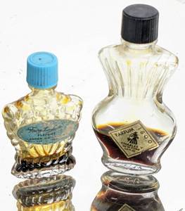 lot 143 image: Antique Mini Glass Perfume  Lotion Bottles and Remants with Silverplate Vanity Mirror and Trays