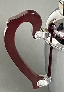 lot 125 image: Stylish Mid-Century Chrome Martini Pitcher with Red Bakelite Handle by Cromwell Silver Co.
