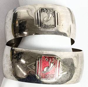 lot 240 image: Art Deco 1933-1934 Chicago Worlds Fair Souvenir Bracelets and Trivets