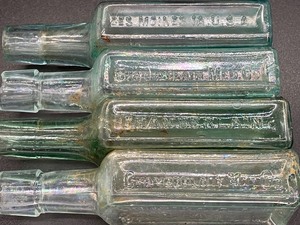 lot 368 image: 20 Antique Glass Medicine Bottles with Embossed Advertising