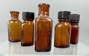 lot 387 image: Antique Amber Glass Bottles 10 Pieces #4