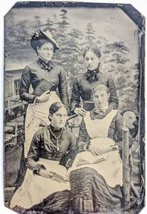 lot 492 image: Three Tintype Family Studio Photographs - One Hand-Colored