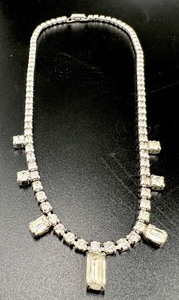 lot 472 image: A Vintage Lot of Rhinestone Jewelry - Necklace, Three Bracelets and Screw-Back Earrings