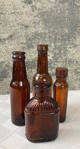 lot 533 image: Assortment of Vintage Dark Amber Glass Bottles- Lysol, Neo-Reargon, Sharp & Dohme & more