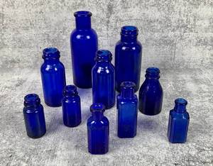 lot 408 image: A Collection of 10 Vibrant Cobalt Blue Glass Bottles