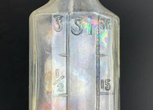 lot 523 image: 20 Antique Clear Glass Bottles with Measurement Markings