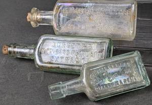 lot 522 image: 10 Antique Iridescent Clear Glass Bottles- Burnetts, Hospital Drug Store, Pfiffer Chemicals & More