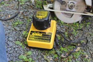lot 100 image: DeWalt 9.6V Battery Charger with Battery