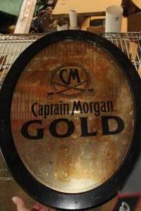 lot 33 image: Captain Morgan Gold Wall Mirror