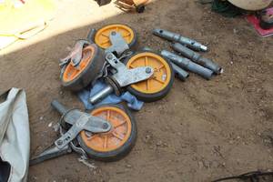 lot 165 image: Lot of (8) Scaffolding Parts - (4) Caster Wheels, (4) Scaffold Connectors