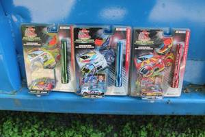 lot 266 image: Racing Champions Under The Lights Diecast Metal Replica 164 Scale (in original packaging) with Flashlight