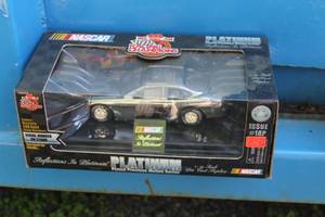 lot 273 image: Racing Champions Platinum 1 of 4999 Issue #18P #94 Diecast Metal Stock Car Replica 124 Scale (in original packaging)