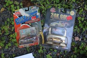 lot 276 image: Lot of (2) Racing Champions #5 Kelloggs 24K Gold, #6 Mark Martin War Paint Diecast Metal Stock Car Replica 164 Scale (in original packaging)