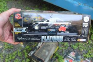 lot 279 image: Racing Champions Platinum 1 of 2499 Issue #12P #9 Diecast Metal Stock Car Replica 124 Scale (in original packaging)