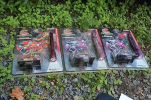 lot 282 image: Lot of (3) Racing Champions Under The Lights #99, #99, #94 Diecast Metal Replica 164 Scale (in original packaging) with Flashlight