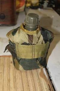 lot 455 image: Plastic Canteen with Camo Case