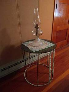 lot 82 image: Glass Top Round Table w Hurricane Lamp