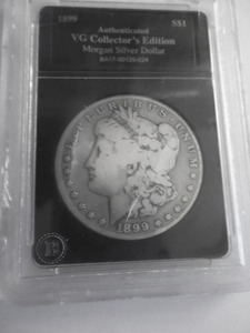 1899 S Morgan Silver Dollar In Graded Holder