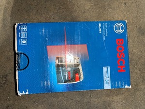 lot 35 image: Bosch 30 ft. Cross Line Laser Level Self Leveling with 360 Degree Flexible Mounting Device and Carrying Pouch