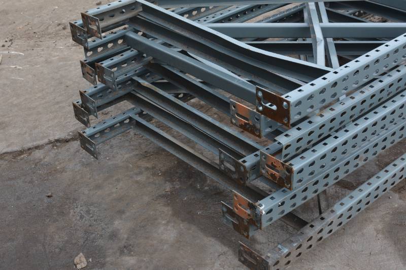 lot 23 image: Qty of bottom (4) 12 x 42 x 1.5 Uprights teardrop style
