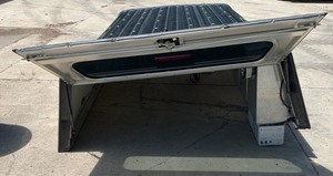 lot 1004 image: Aluminum Truck Topper With AC Power Inverter