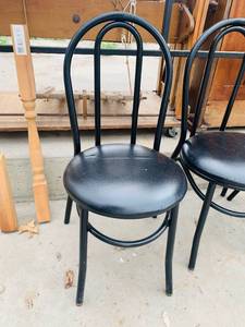 lot 15 image: Four Black Vinyl and Metal Frame Chairs