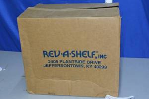 lot 131 image: New Rev-A-Shelf pull-out hamper and utility baskets