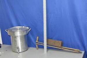 lot 81 image: turkey fryer pan and antique corn planter