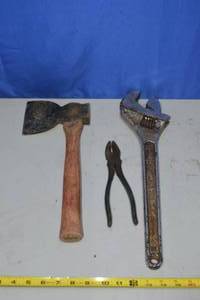 lot 49 image: Crescent 18 Adjustable Tapered Handle Wrench, hatchet and pliers