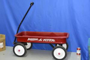 lot 115 image: Radio Flyer wagon with cushion