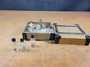 Antique Weed and Seed Sample Bottles in Case - Case is about 8 x 8 x 3