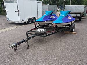Pair of Arctic Cat Tigershark Jet Skis on Trailer