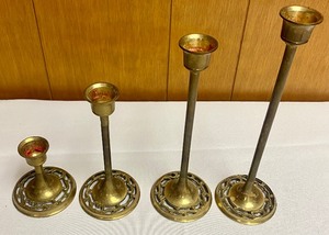 lot 336 image: Set of Four Vintage Brass Candle Holders