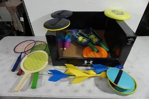 lot 72 image: Assorted Yard Toys - Paddles, Darts, Frisbees