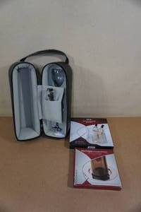 lot 64 image: On-The-Go Wine Bottle Carrier with Cork Screw and Set of Glasses, plus Extras
